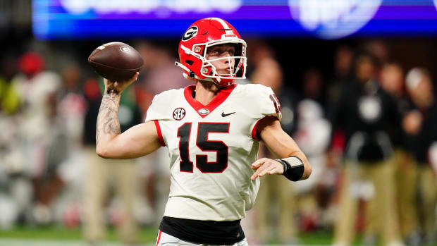 Dec 2, 2023; Atlanta, GA, USA; Georgia Bulldogs quarterback Carson Beck (15) throws a pass against the Alabama Crimson Tide in the third quarter of the SEC Championship at Mercedes-Benz Stadium.